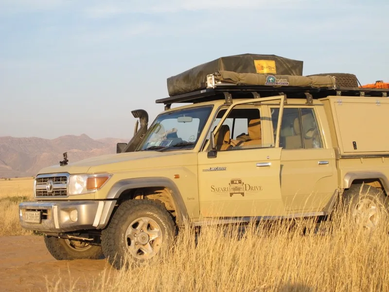 Safari Drive Land Cruiser 79 double cab with a roof tent, a fleet vehicle developed with Paul Marsh