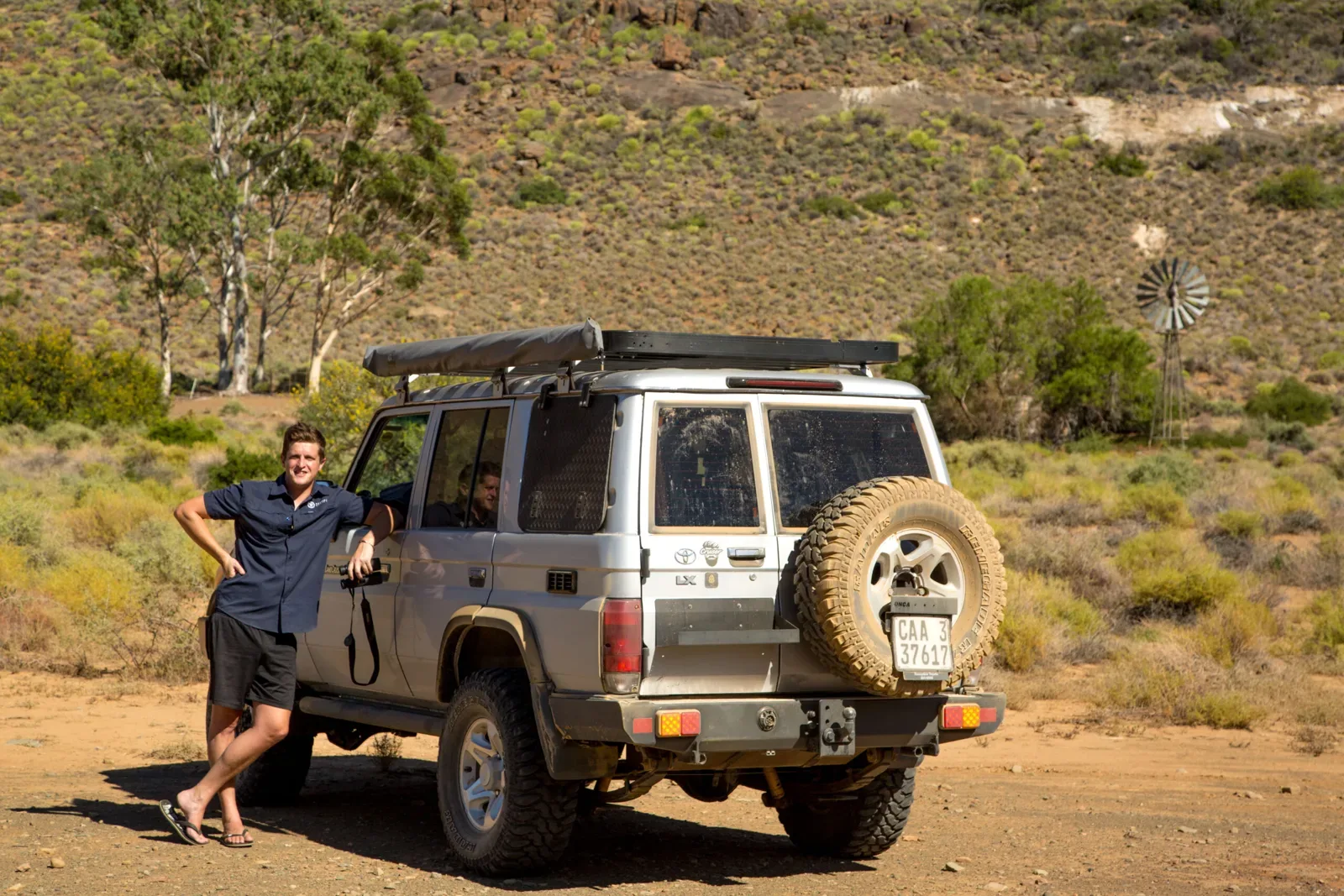 Mark Bland of Routes Rediscovered with his 76 Series Land Cruiser on a gravel track