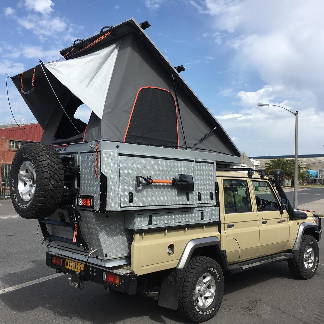 Alu-Cab hardshell rooftop tent open on Land Cruiser 79 series double cab with full canopy and drawer system