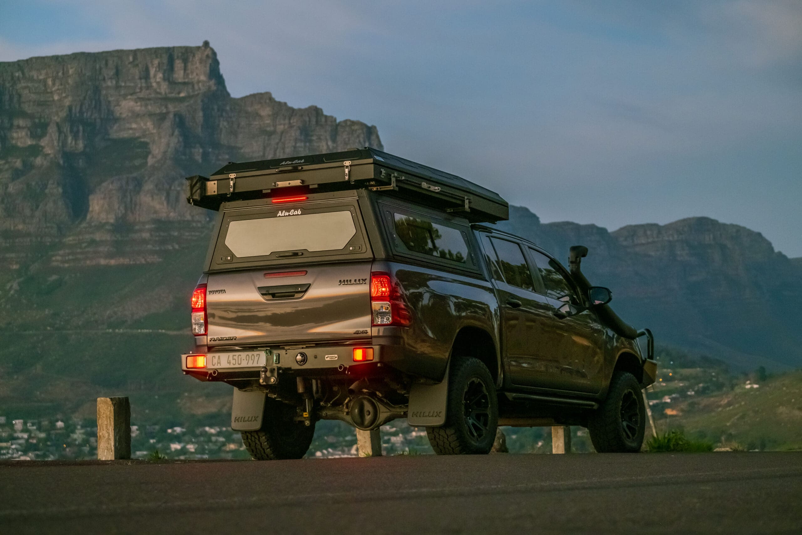 Closed Alu-Cab Gen 3-R rooftop tent with Table Mountain in the background, Cape Town