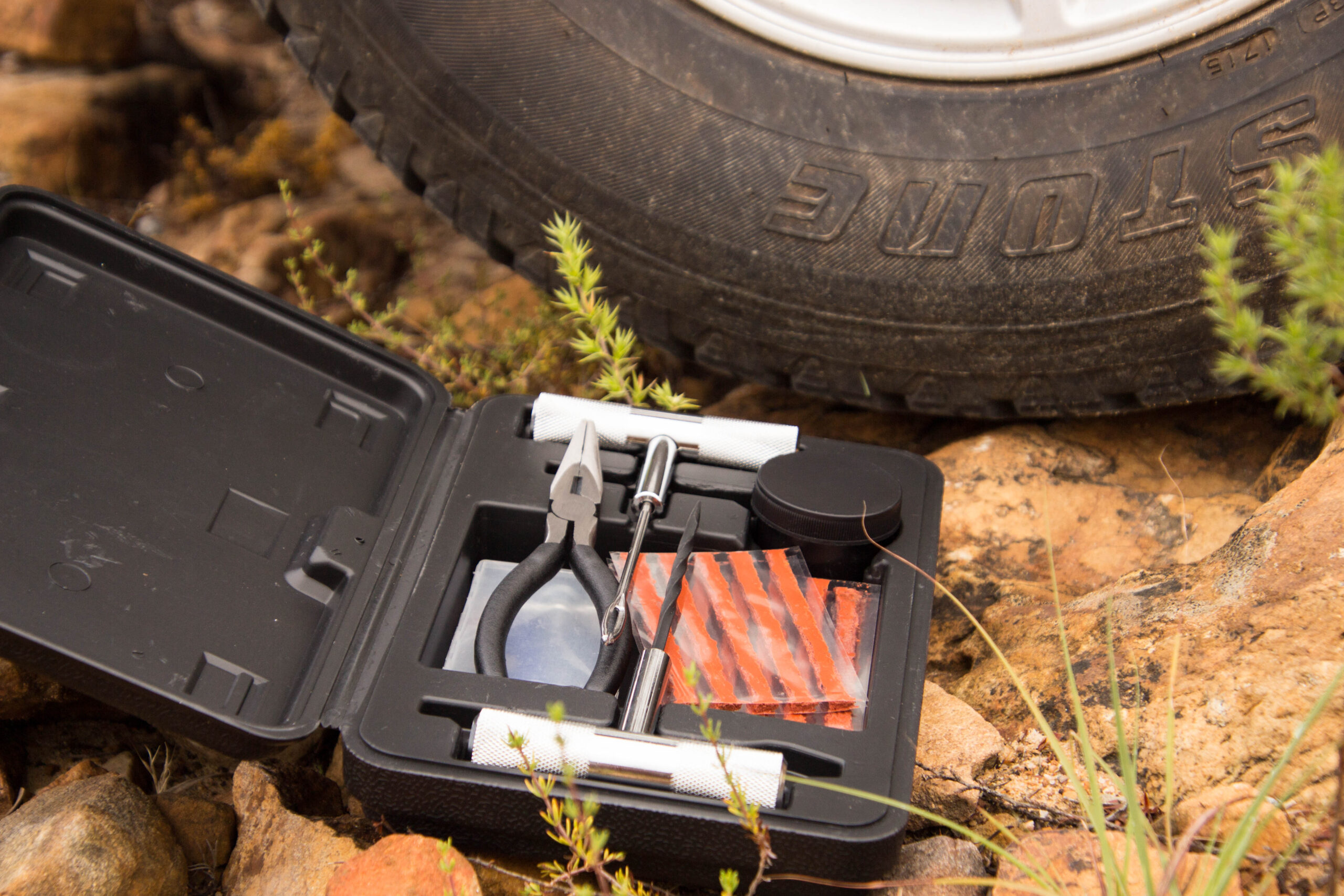Inserting a rubber plug into a punctured 4x4 tyre