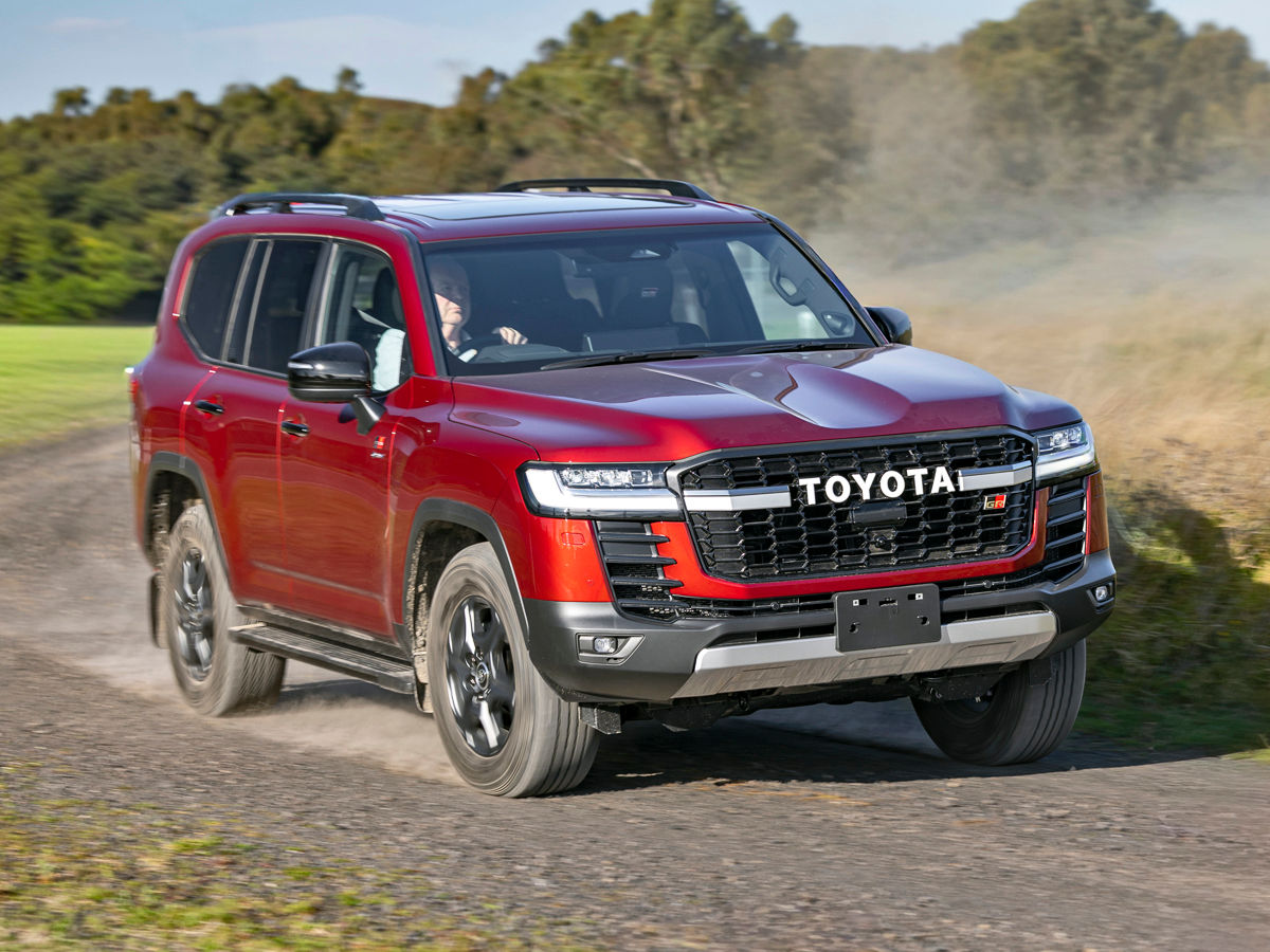 The new Toyota Land Cruiser 300 Hybrid GR-Sport on a gravel road