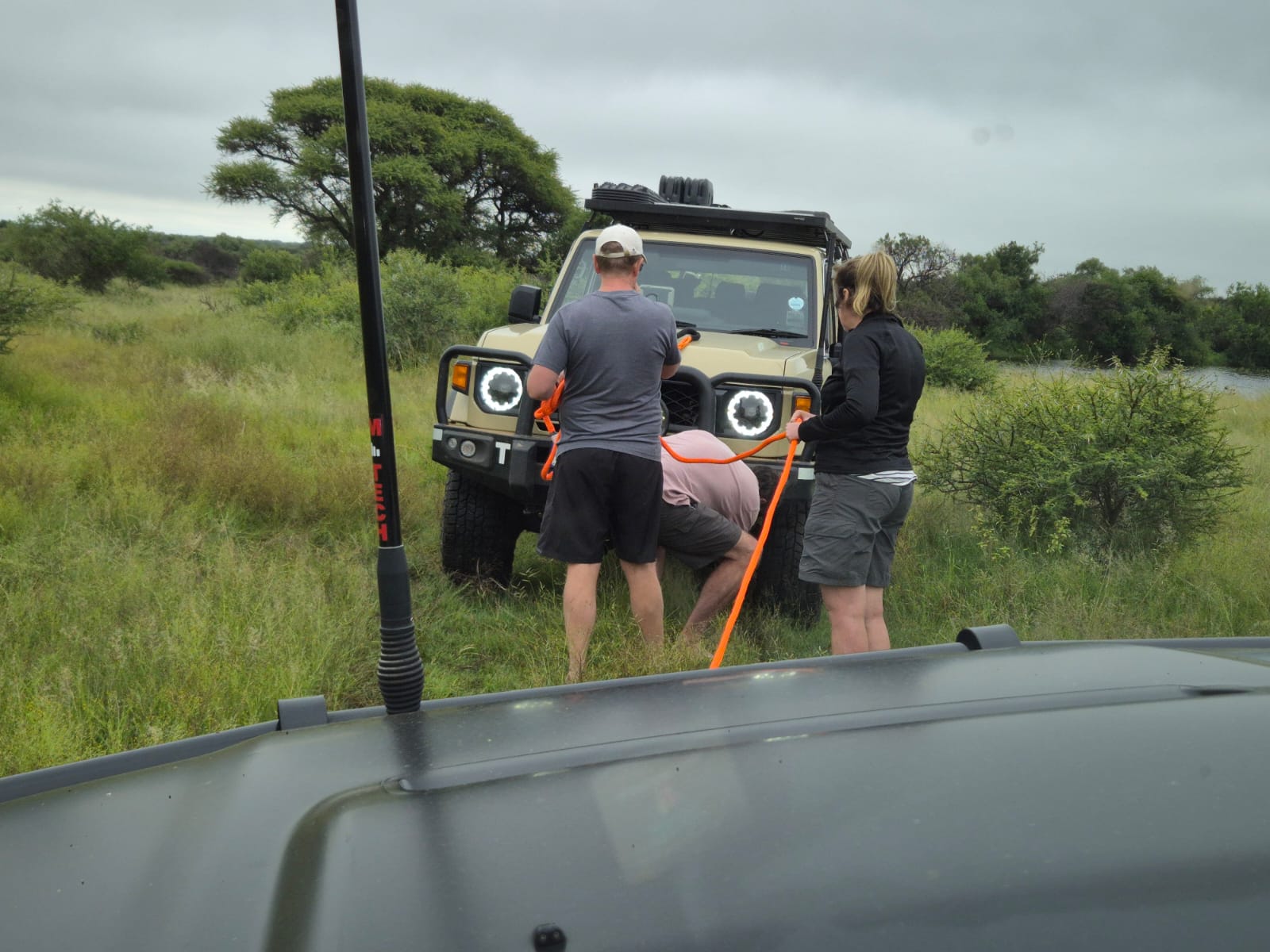 Vehicle recovery using a snatch strap in the field